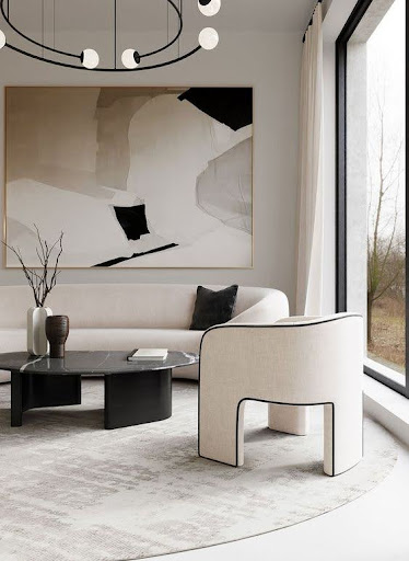Stiligt - Ett modernt vardagsrum med vita möbler och en stor tavla inredningsdesign.